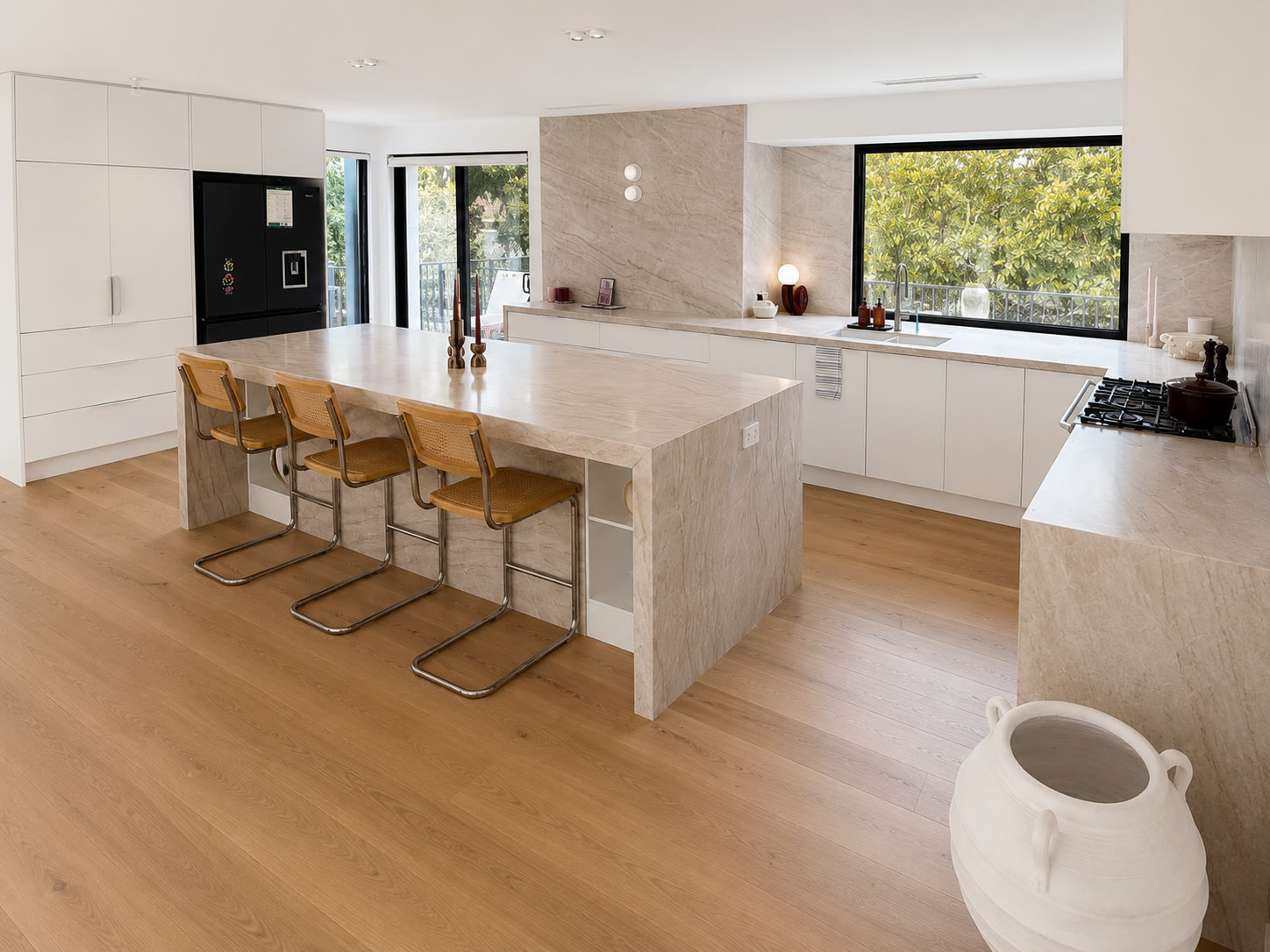 Warm stone island kitchen with timber floors, Greensborough